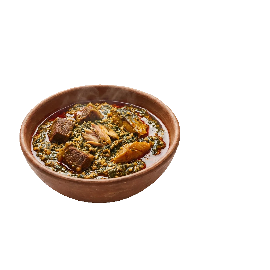 A clay bowl of egusi soup with beef and greens
