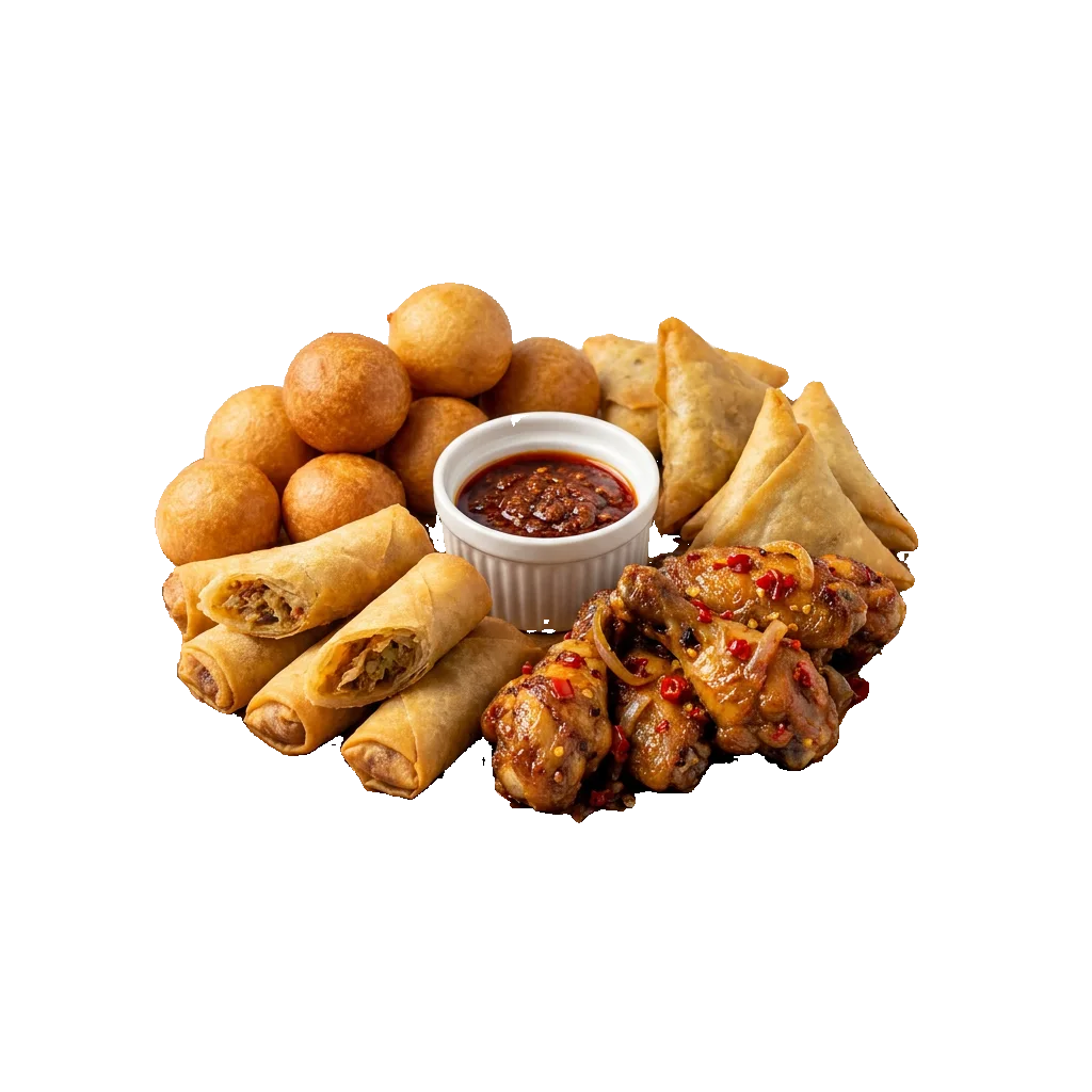 A platter of small chops: puff-puff, spring rolls, samosa and peppered chicken