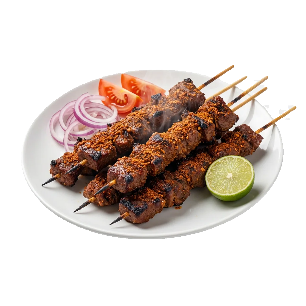A plate of suya beef skewers with onions and lime